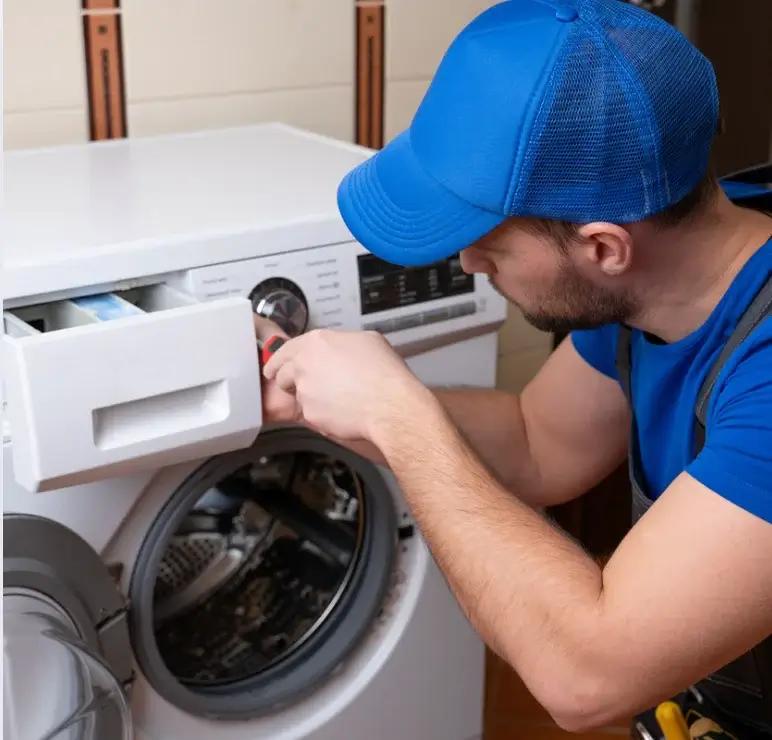 Technician repairing an Admiral appliance